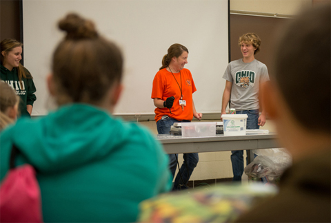 Students studying meteorology at Ohio University assist Nelsonville-York Elementary School teacher Olivia Kittle (center) with an experiment during her class' recent field trip to the University.