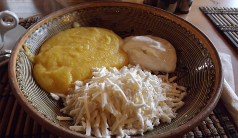 East meets West:  One of the Romanian national dishes – Polenta with fresh sheep’s cheese and sour cream.