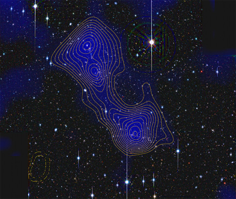 Clowe and colleagues recently discovered that these two galaxy clusters, Abell 222 and Abell 223, are connected by a filament of dark matter. Image courtesy of Jorg Dietrich.