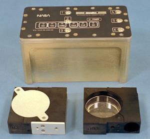 Figure 1 – A sealed BRIC unit with two PDFU units – one sealed and the other open with its petri dish (or plate) contents exposed (Photo: NASA)