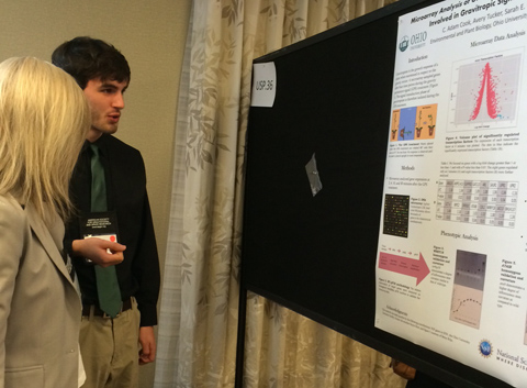 Adam Cook presents a poster at the American Society for Gravitational and Space Research.