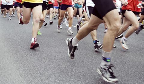 Runners running in marathon race in city