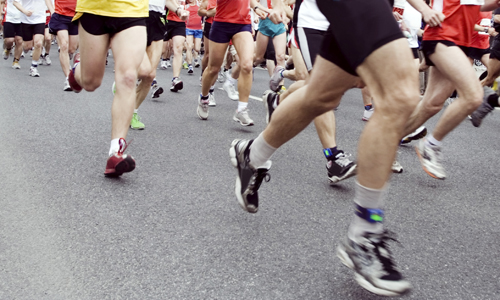 Runners running in marathon race in city