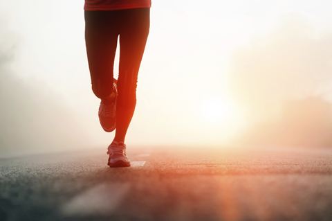 female distance runner at dawn