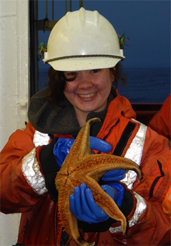 biology graduate student with starfish