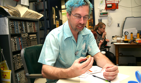 Lawrence Livermore National Lab physicist Darren Bleuel holds a silicon detector used to detect charged particles.