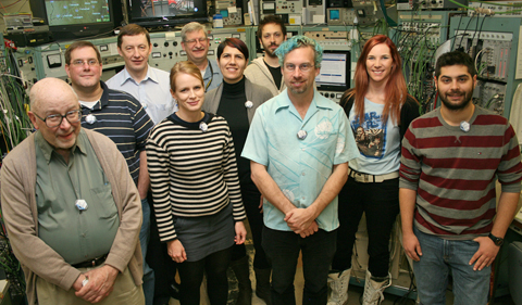 Meeting in the Edwards Accelerator Lab control room are (L to R) Distinguished Professor Steve Grimes (OHIO), Sean Liddick (NSCL/Michigan State University), Alexander Voinov (OHIO), Therese Renstrom (University of Oslo), Tom Massey (OHIO), Artemisia Spyrou (Michigan State University), Panagiotis Gastis (Central Michigan University), Darren Bleuel (Lawrence Livermore Lab), Ann-Cecile Larsen (University of Oslo), Stelios Nikas (Central Michigan University). The control room is where all operations on the accelerator and beam lines are monitored and carried out.