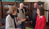 History graduate student Eryn Kane (in red) talks with Rosalynn Carter, as President Carter looks on. Photo credit: National Parks Services and Jimmy Carter National History Site.