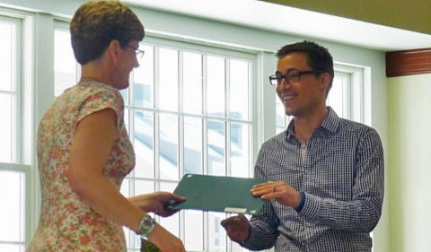 Dr. Morgan Vis recognizes Nicholas Tomeo with the department’s Outstanding Teaching Assistant Award.