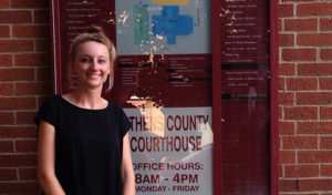 Carrie Ramage standing outside the Athens County Courthouse