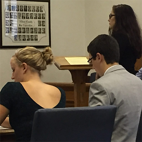 Defense attorney Lori Smith cross-examines a witness while the prosecutors, Stephanie Mertz and Caleb Taulbee, prepare their redirect