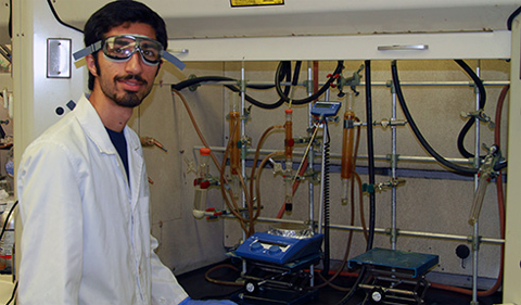 Ramin Rabbani, shown posing in lab with equipment