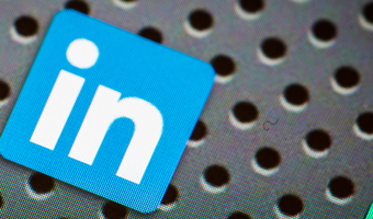 BELCHATOW, POLAND - APRIL 10, 2014: Closeup photo of Linkedin icon on mobile phone screen. Popular social network.