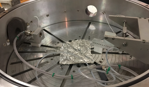 The inside of the scattering chamber was modified for the MIT experiment to allow the detector at the left to be included in a rotatable track location.