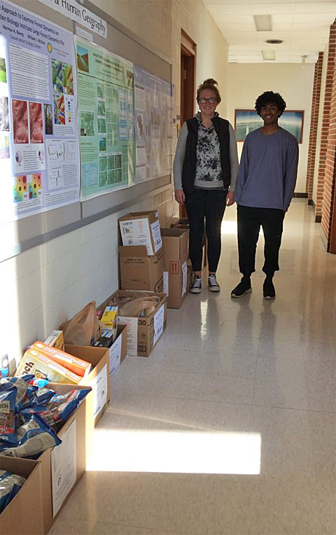 img_0211 Peter Russ, a freshmen in Biochemistry, and Sara Hinck, a graduate student in International Development Studies, posed after they delivered several donation boxes from Grover Center to Clippinger Labs.
