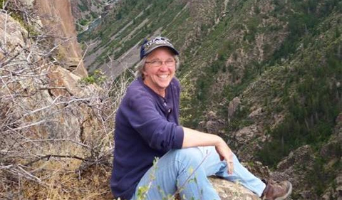 Sarah Wyatt in Colorado, on a ledge on the side of a mountain