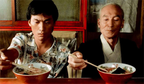 Tampopo movie photo, with 2 men, one young, one old, eating Asian food