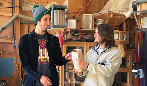 Students Jacob Ballas, and Sam Heckle share samples of the products produced in-house at the Mill. Students were shown how a variety of products can be produced in the milling process.
