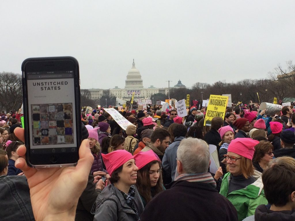 Phone, large crowd, Capitol building