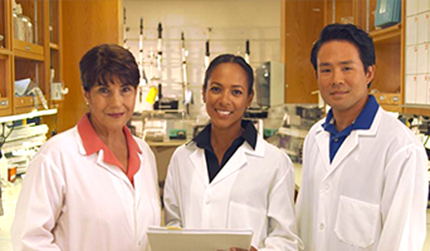 Quidel employees in the lab in white coats