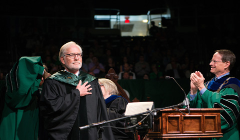 OHIO alum David Crane receives an honrary doctorate degree from Interim President David Descutner. Photo by Ben Siegel