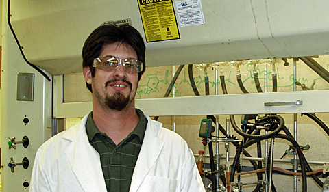 Dr. Eric Masson in lab coat