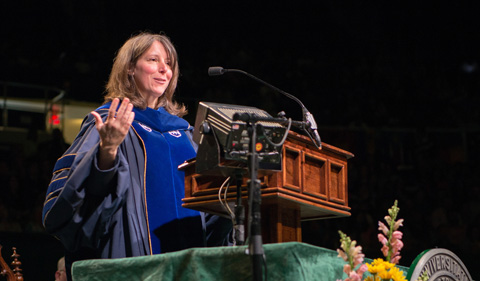 Dr. Risa Whitson, Associate Professor of Geography and the Women's, Gender, and Sexuality Studies Program delivers the graduate commencement address. Photo by Ben Siegel 