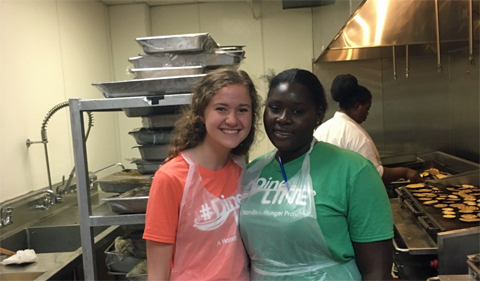 Lydia King during her experience working for Hands for Hunger with a coworker. Photo courtesy of: Lydia King