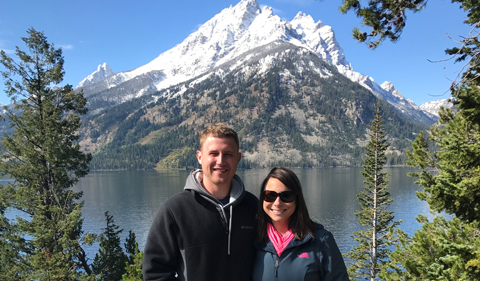 Jake Robertson with his wife, in the mountains, with snow on top