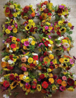 view of red, yellow, white, purple flower bouquets from above