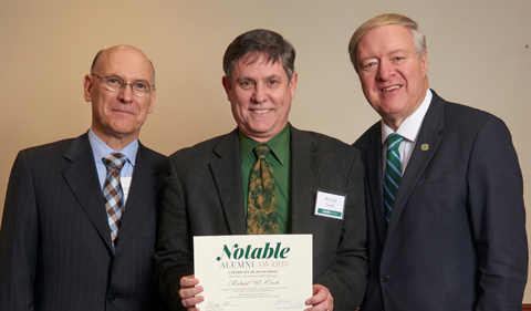 From left, College of Arts & Sciences Dean Robert Frank, alum Richard Couch, and President M. Duane Nellis, with Couch holding a Notables certificate.