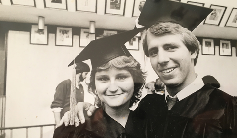 Traci and Steve Ellis at their graduation, wearing cap and gowns