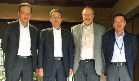 Trancy City Corp. of Japan hosts meeting to discuss summer business internship. Group photo of four men standing.