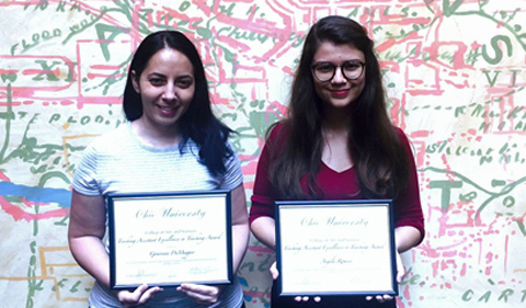From left, Genoveva Di Maggio and Angela Romero, shown here holding their certificates