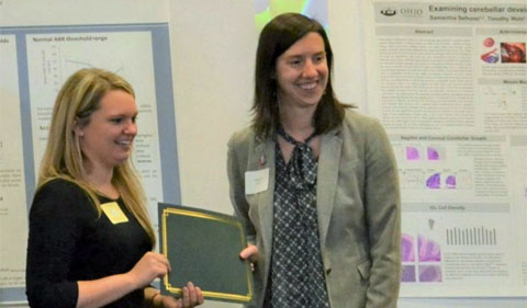 Catherine Early (right) and Mary Gemmel (left) both won first prize for graduate student posters at Neuroscience Research Day.