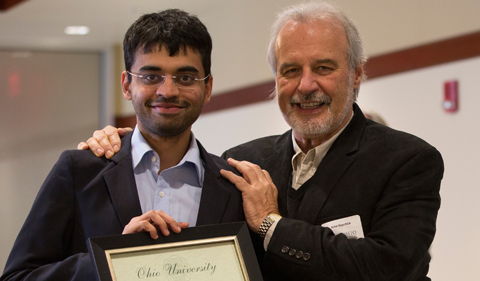 Pratik Shriwas and John Kopchick, posing together and holding certificate