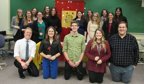 The new initiates and current officers of Sigma Delta Pi, shown here posing for a group photo.