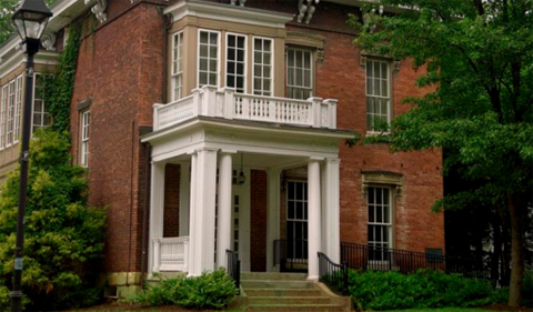 The Trisolini House at Ohio University is home to the Ping Institute. It is a 2-story red brick buiding.