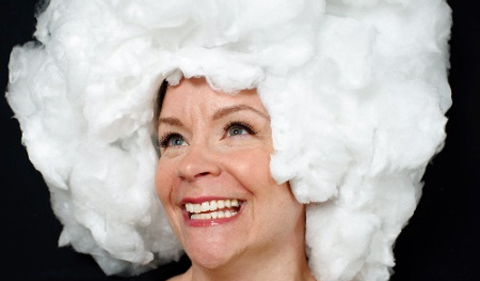 Jami Curl, wearing a wig that looks like white cotton candy.