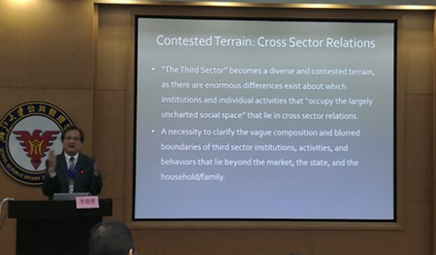 Dr. Jieli Li gives keynote at Zhejiang University, shown here at lecturn with screen.