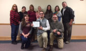 Faculty and staff in the Ohio Program of Intensive English pose for a photo with the certificate they received from the Commission on English Language Program Accreditation acknowledging the program’s initial five-year accreditation.