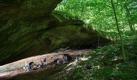 Anthropology Field School students with Dr. Paul Patton, shown in a large cavern