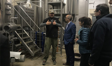 Jackie O's owner Art Oestrike gives visitors a tour at Jackie O's brewery.