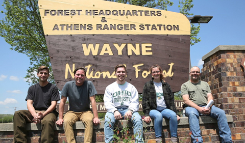 The Archaeology Intern Team posing with the Wayne sign.