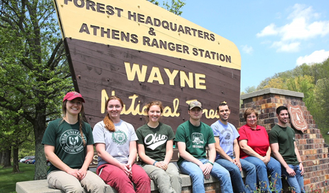 The Wildlife Biology Team poses with the Wayne sign.