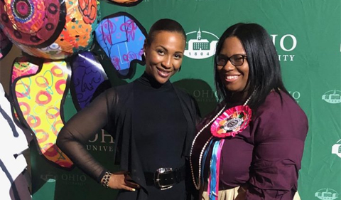 From left, Dr. Rebecca Grant and Joselyn Hines at OHIO's 2018, standing in front of university banner.