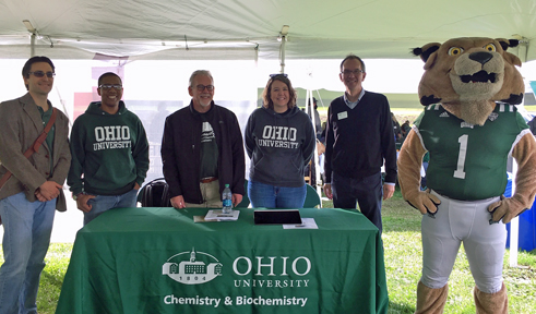 Rufus hears about the new chemistry building with, from left, Dr. Justin Holub, Dr. Travis White, Dr. Steve Bergmeier, Dr. Jessica White and Dean Joe Shields.