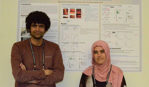Hariprakash Haragopal and Sazan Ismael, posing in front of their poster.