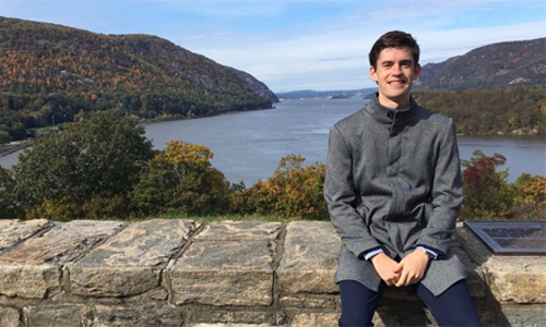 Max Annable at West Point Academy, overlooking a river in the background