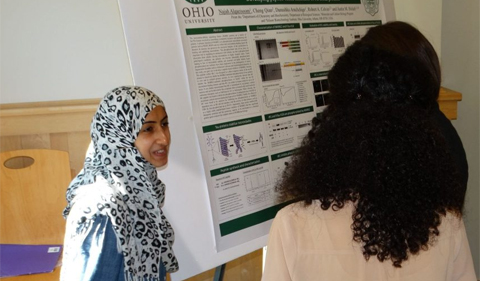 Najah Al Qaeisoom presenting her research on phosphorylation of the tau protein to students and faculty during Neuroscience Research Day 